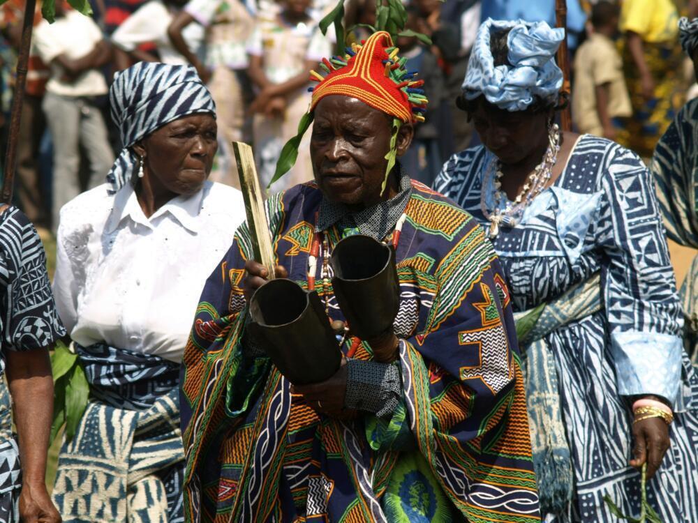 Elderly people in traditional african attire during a ceremony